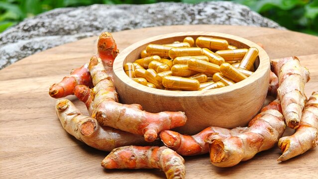 Turmeric curcumin capsules with rhizome (root).
