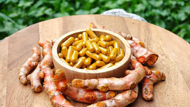 Turmeric curcumin capsules with rhizome (root).