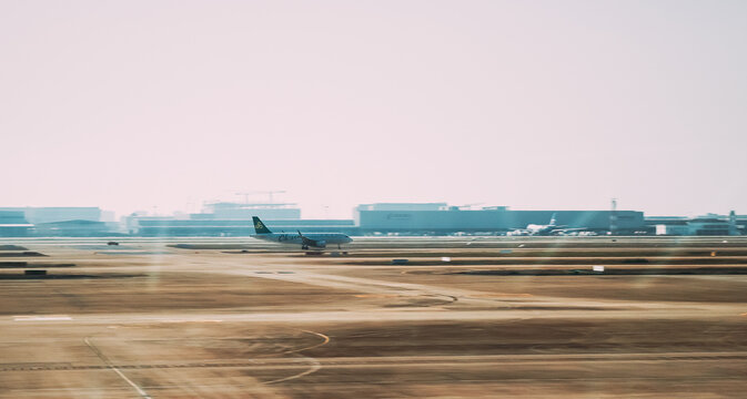 Airbus A320 Spring Airlines aircraft taxi motion blur effect at airport runway