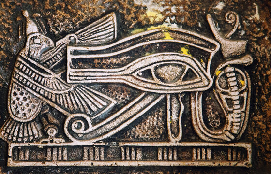 Ancient Egyptian Eye Of Horus Relief With Falcon Symbol On Stone Surface