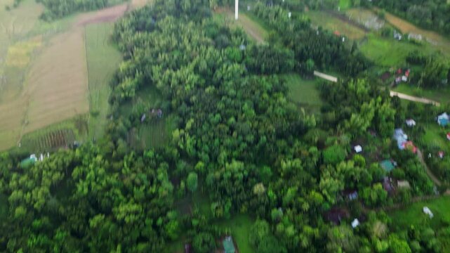 Rural Town With San Lorenzo Wind Farm In Guimaras, Philippines. Aerial Tilt-up Shot