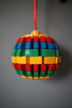 LEGO pieces forming broken ornament with gaps and shifts creating abstract fragmented pattern