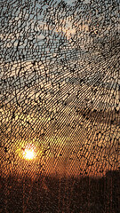 Fototapeta premium golden sunlight reflected through the broken window