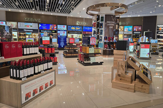 Changi, Singapore - Jan 21, 2026: The storefront of Lotte Duty Free, a major retail shop selling spirits and wine, in the transit area of Terminal 4 at Singapore Changi Airport.
