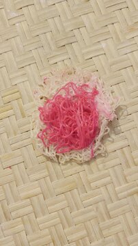 String hoppers on woven bamboo mat sri lankan culinary delights white and pink asian noodles traditional cuisine
