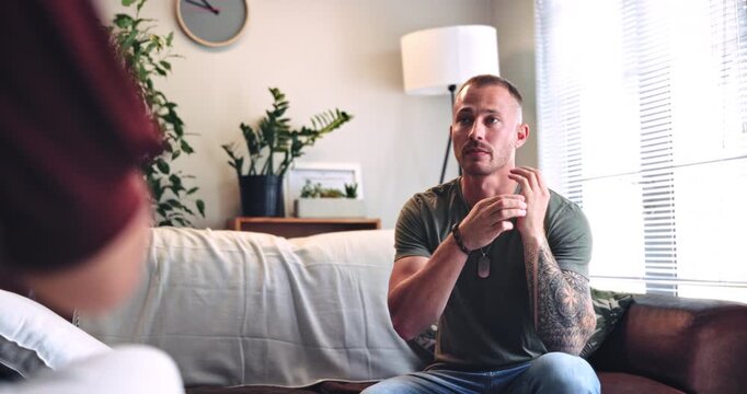 Therapy, discussion and man with eft tapping on sofa for anxiety, mental health or holistic healing. Psychology, calm and male person with spiritual energy for reiki treatment, breathe or zen in home