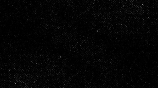 Black Halftone Grainy Texture Background,Flickering dark vintage film grain overlay for retro cinematic and grunge video projects.