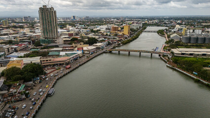 Obraz premium Panay Island, Iloilo City Cityscape skyline aerial drone view with river and downtown church 