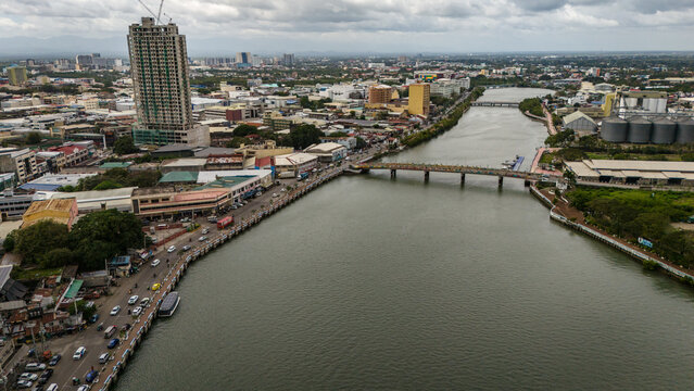 Panay Island, Iloilo City Cityscape skyline aerial drone view with river and downtown church 
