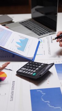 Business team analyzing financial data and reports