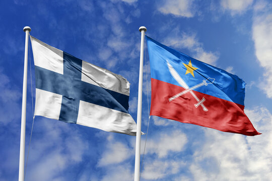 Finland and United Wa State flags waving in a clear blue sky, symbolizing a powerful diplomacy, expanding global trade, a strategic partnership, and a shared vision of unity for a sustainable future.