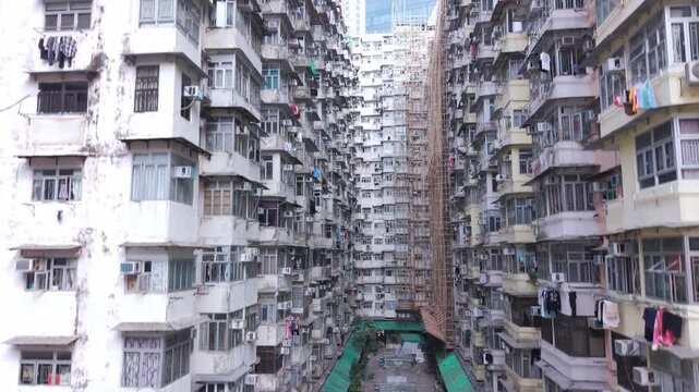 Aerial view of Hong Kong&rsquo;s famous Monster Building in Quarry Bay, showcasing its dense residential blocks and striking repetitive facade in the urban landscape.