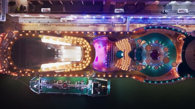 Aerial view of a luxury cruise ship by night in Victoria Harbour (hijacked)