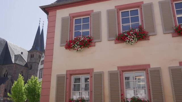 Traditional German architecture house with window shutters and flower boxes in Saarburg Germany