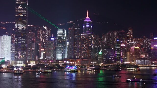 Aerial night view of Victoria Harbour Hong Kong, dazzling skyscrapers on both Kowloon and Hong Kong Island sides (2)