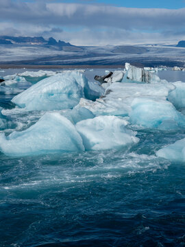 Icebergs flowing into the ocean along the narrow strait from Iceland's Jokulsarlon Glacier Lagoon