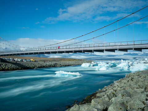Bridge carrying route 1 over Glacier Lagoon in Iceland with icebergs floating