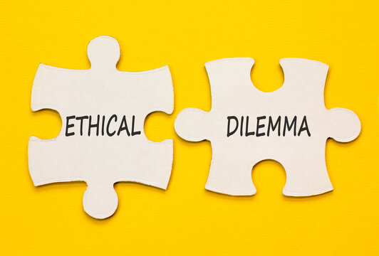 Ethical dilemma words symbol. Concept words Ethical dilemma on beautiful white puzzles. Beautiful yellow background. Business and Ethical dilemma words concept. Copy space.