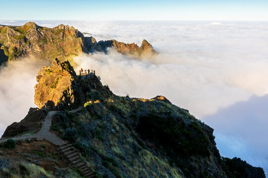 Mountain hiking trail at Pico do Areeiro with clouds in Madeira