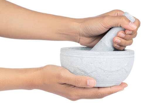 hands holding a mortar and pestle isolated on white background