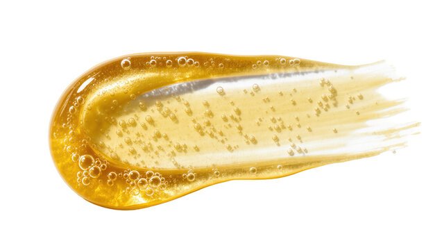 Viscous golden liquid smear with tiny air bubbles, beauty product cosmetic gel texture