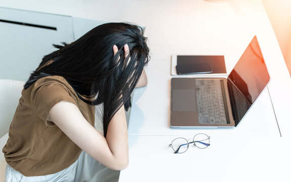 Anxiety disorder, panic attack working woman, stressful depressed student or businesswoman, burnout person with mental health illness, headache and migraine, sitting in front of laptop computer desk