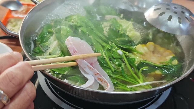 Fish dipped in hot pot