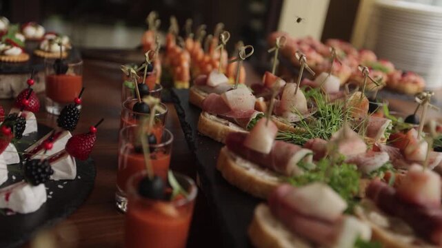 Gourmet Catering Appetizers and Finger Food Served on Elegant Buffet Table at Luxury Event