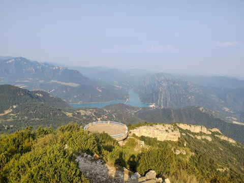 High-angle view of the Figuerassa circular observation deck overlooking the Baells reservoir and the Pyrenees mountain range in Cercs, Catalonia