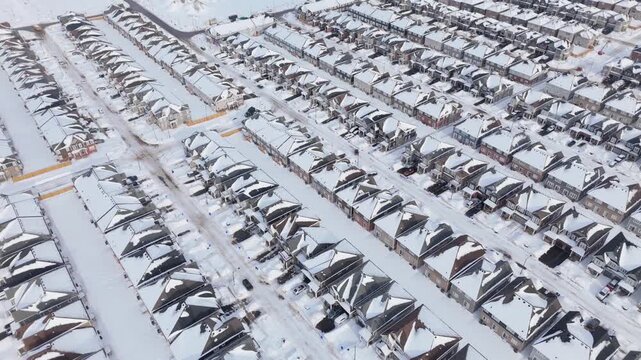 Houses In A Newly Constructed Community Neighborhood Of Erin During Ontario Housing Shortage, Aerial Orbiting Shot.