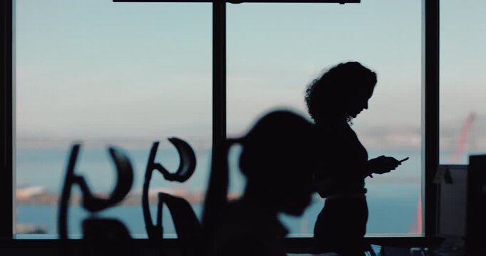 Walking, businesswoman and texting with smartphone in office, silhouette and pr schedule on website. Business, shadow and person with mobile for communication, publicist and chat on social media app