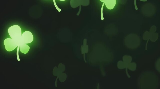Slow motion tracking shot of glowing clover leaves drifting across dark background for saint patrick day greeting design