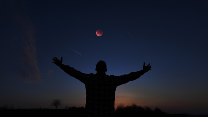 Fototapeta premium Amateur astronomer enjoying observing stars, planets, Moon and other celestial objects.