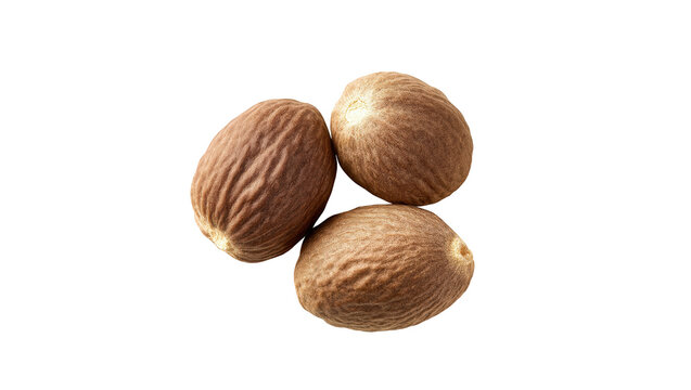 A trio of whole, dried nutmeg seeds ready for grinding into fragrant spice.