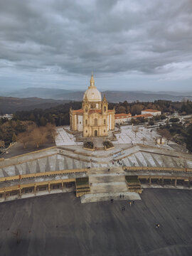 Aerial view of the imposing Santuario de Nossa Senhora do Sameiro bathed in soft sunlight, its grand staircase leading to the heavens, Braga, Braga, Portugal.