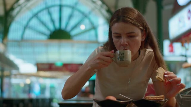 Female traveler enjoying Singaporean breakfast at Lau Pa Sat hawker market with delicious street food and tourism culture in Asia