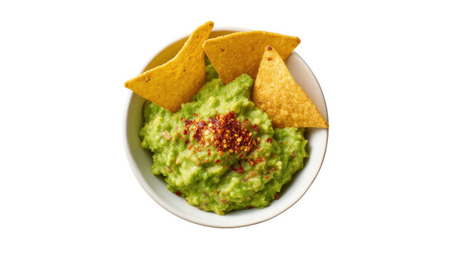 Delicious freshly made chunky guacamole dip with crispy corn tortilla chips and chili flakes