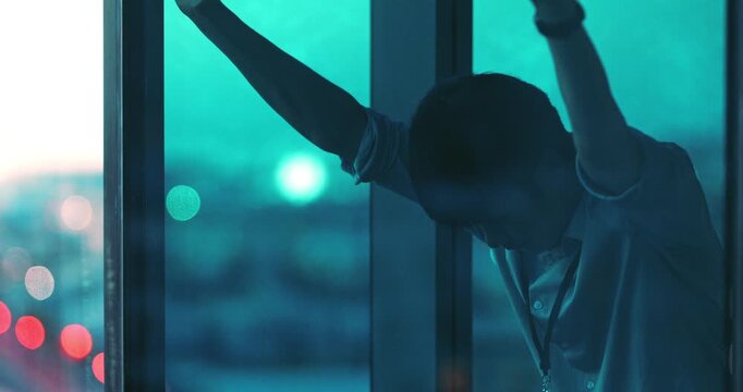 Window, business and man with stress, thinking or investment fail with deadline pressure at night. Reflection, mistake and Asian person in workplace with financial crisis, liquidation risk and bokeh