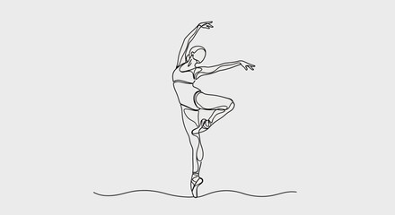 Elegant figure en pointe, arms extended in graceful ballet pose © STwul