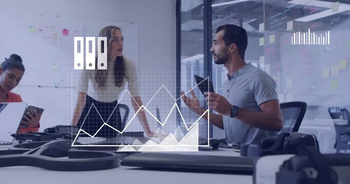 Man with tab gesturing showing drone frames woman leaning charts over table for tech analytics