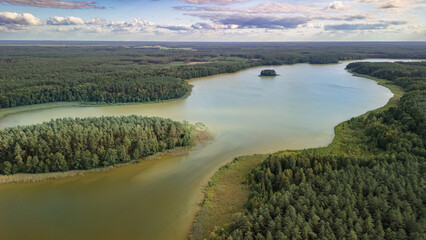 Obraz premium Panoramic aerial view of Lake Nidzkie surrounded by Masurian forests, Poland