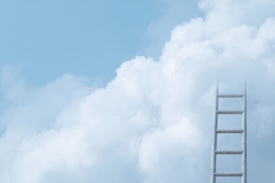 ladder reaching into fluffy cloud against bright blue sky surreal aspiration concept