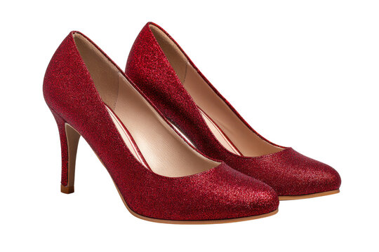Pair of sparkling red glitter high heel shoes on black background heels