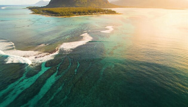 Showing forested tropical peninsula rising behind sandy shoreline, with coral reef lines visible