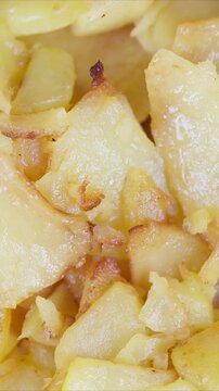 Crispy potato bites. Golden fried potatoes with tender insides. Savory crunchy fried potato morsels boasting crispy outer crust and juicy tender filling throughout