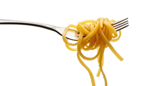 Golden yellow linguine pasta expertly twirled around a gleaming silver fork, tasty meal