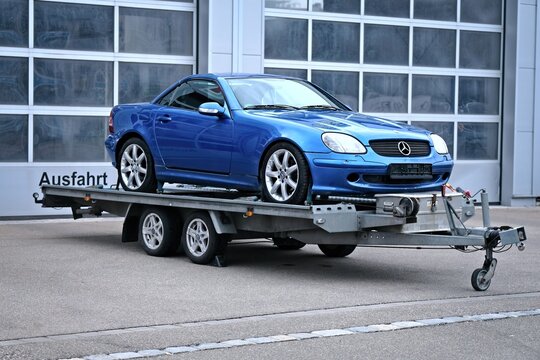 Neu-Ulm, Germany - March, 25, 2026:  Mercedes Benz R 170 SLK on a Car trailer. 