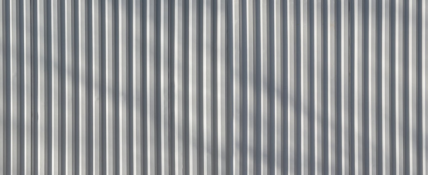 Corrugated metal wall creating abstract texture pattern