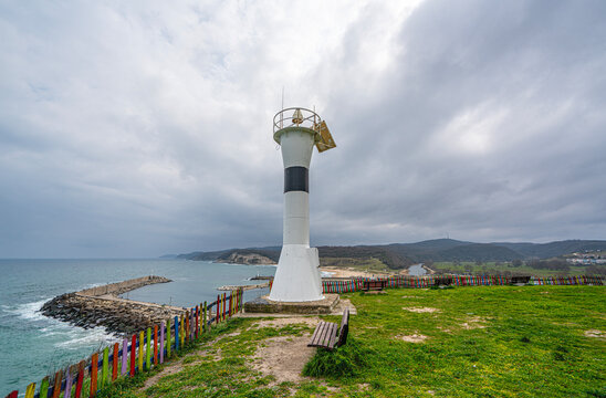 The scenic views of Kıyık&ouml;y Lighthouse, historically known as Medea, over the fishing harbor on the west Black Sea coast in the Vize, Kırklareli, Turkey. 