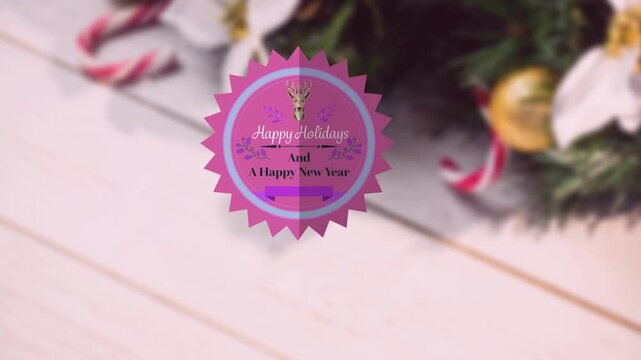 Animation of happy christmas text over decorations
